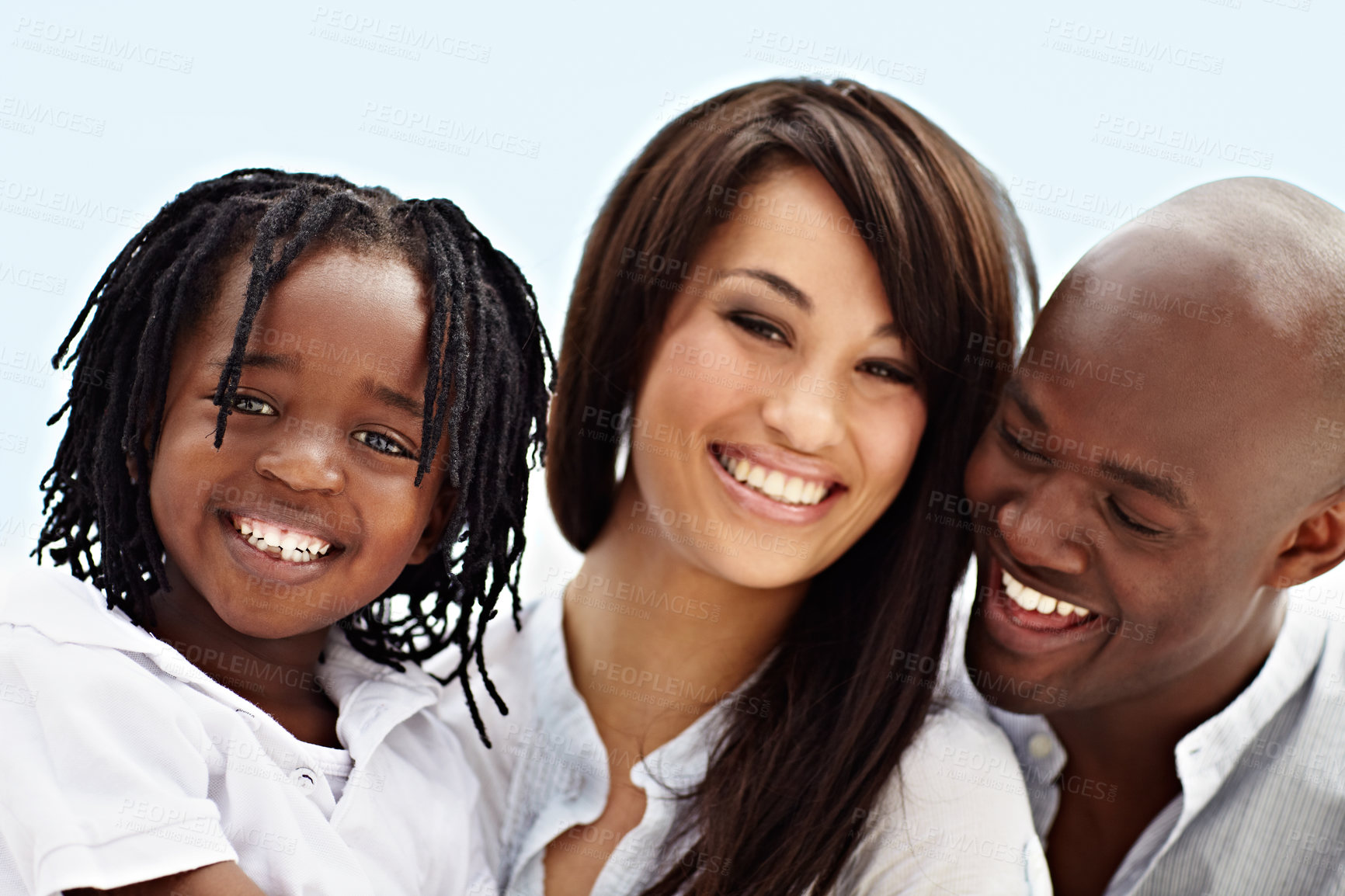 Buy stock photo Portrait of a smiling young family standing outside