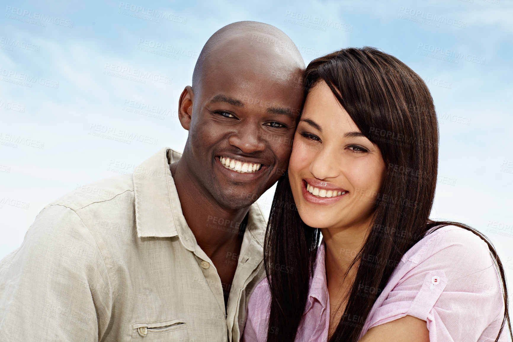 Buy stock photo Portrait of an affectionate couple enjoying a day outside together