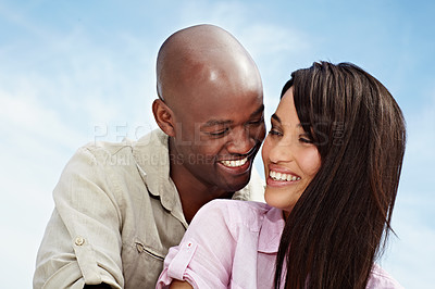 Buy stock photo Shot of an affectionate couple enjoying a day outside together