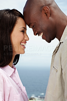 Buy stock photo Closeup shot of an affectionate couple standing face to face outside