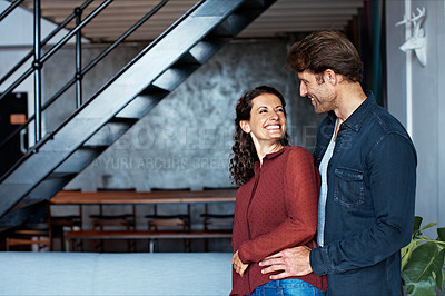 Buy stock photo Shot of an affectionate mature couple standing in their living room