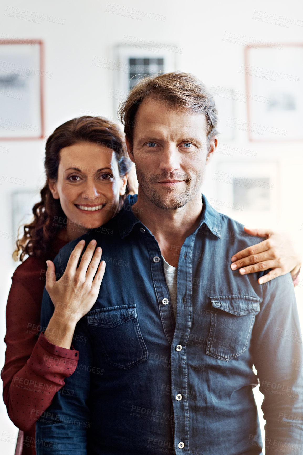 Buy stock photo Smile, love and portrait with couple in home for bonding, connection and weekend break. Marriage commitment, care and support with man and woman in living room of house for comfort, happy and calm