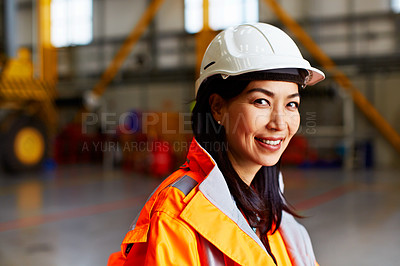 Buy stock photo Portrait of a woman in workwear standing in a large industrial building