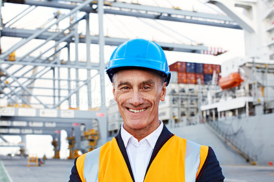 Buy stock photo Portrait of a mature man in workwear standing outside on a large commercial dock