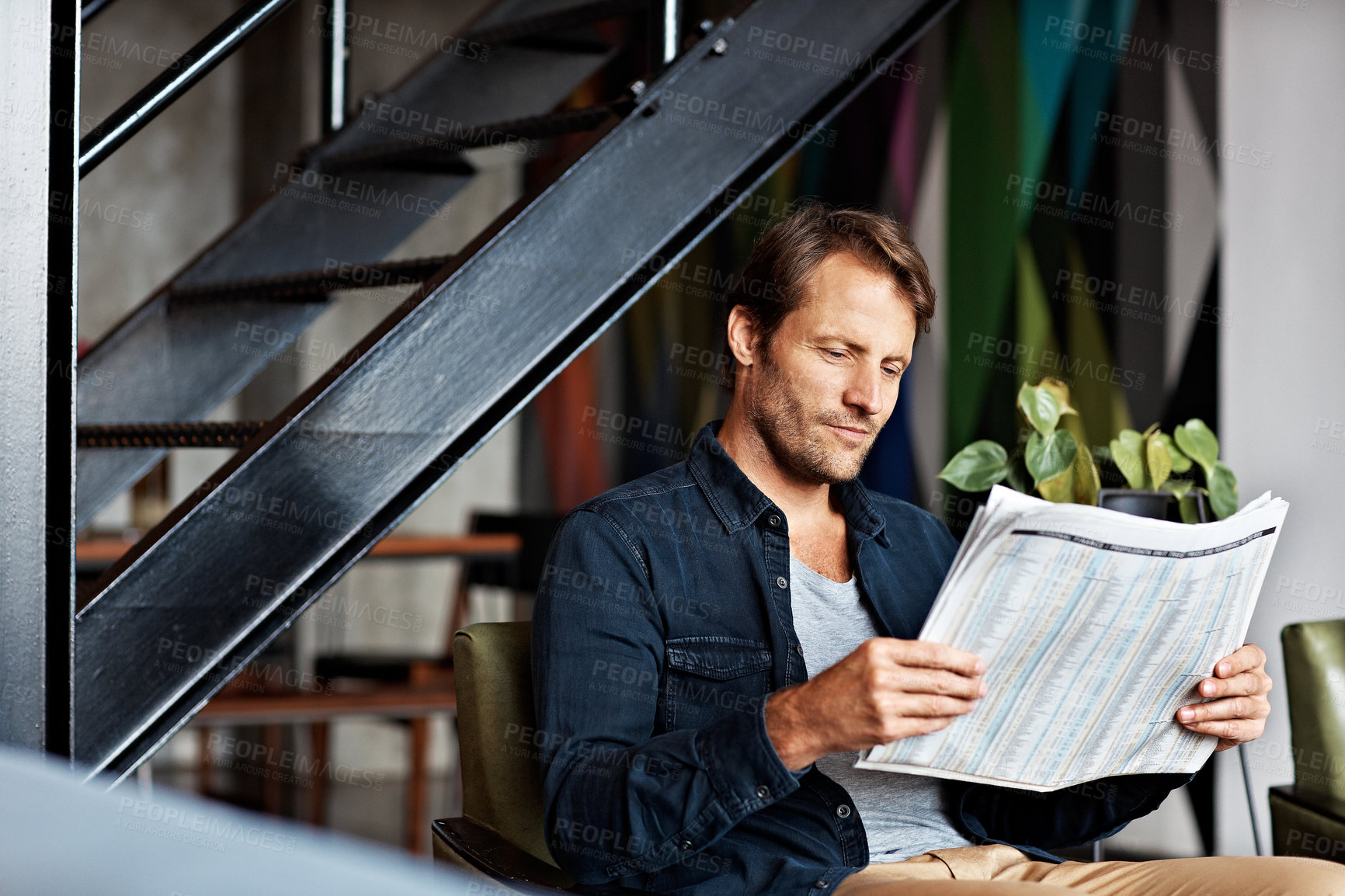 Buy stock photo Newspaper, reading and relax with man on sofa for article, headline announcement and update. Media publication, bulletin report and tabloid with person in living room in house for story and column