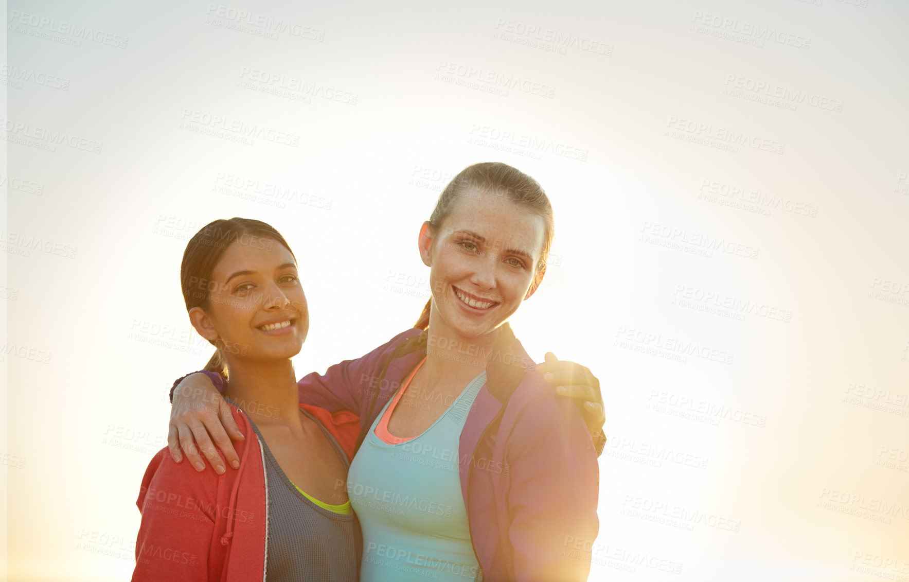 Buy stock photo Sky, fitness and portrait of girl friends outdoor for exercise, bonding or wellness together. Hug, happy and women with space for sports, workout or cardio for health on weekend morning by flare.