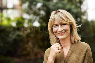 Buy stock photo Portrait of a smiling mature woman standing outside