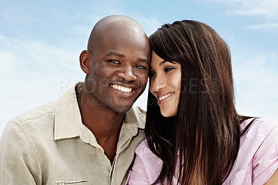 Buy stock photo Portrait of an affectionate couple enjoying a day outside together