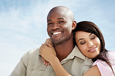 Buy stock photo Portrait of an affectionate couple enjoying a day outside together
