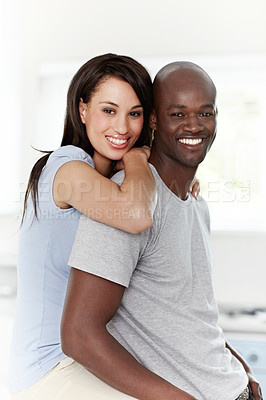 Buy stock photo Portrait of an affectionate young couple sitting in their bedroom