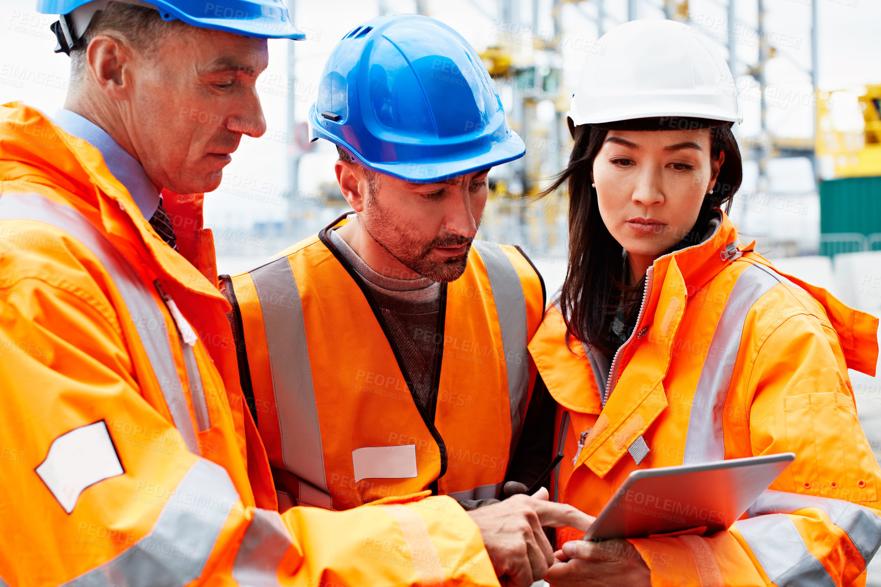 Buy stock photo People, meeting and pointing with tablet in depot for industrial logistics or shipping checklist. Group, employees or team in shipyard with technology for supply chain security, cargo or stock check