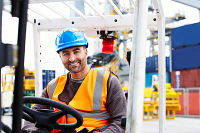 Buy stock photo Portrait of a forklift operator working on a large commercial dock