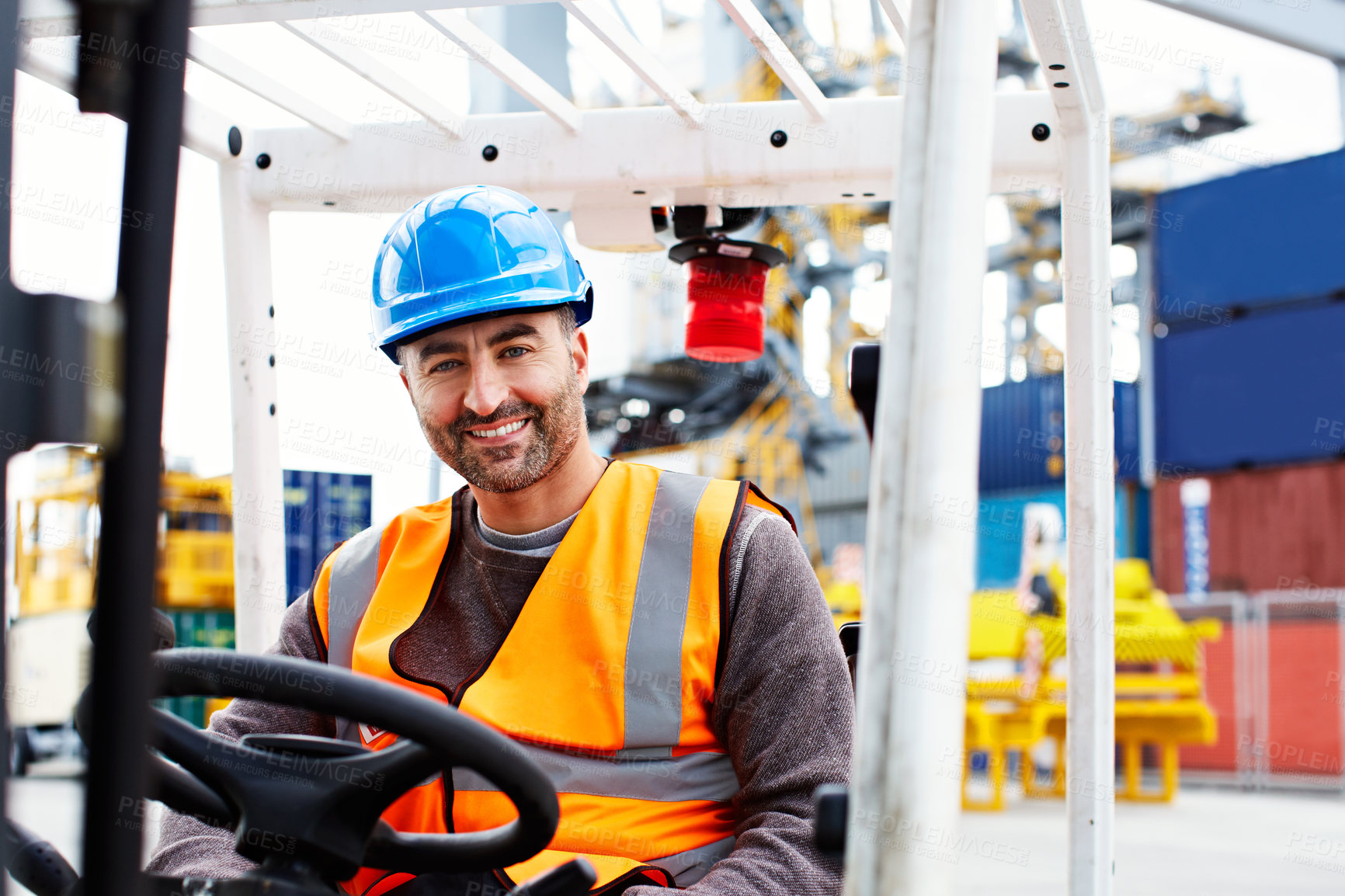 Buy stock photo Portrait of a forklift operator working on a large commercial dock