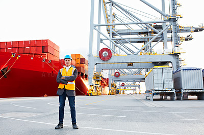 Buy stock photo Portrait of a mature man in workwear standing outside on a large commercial dock