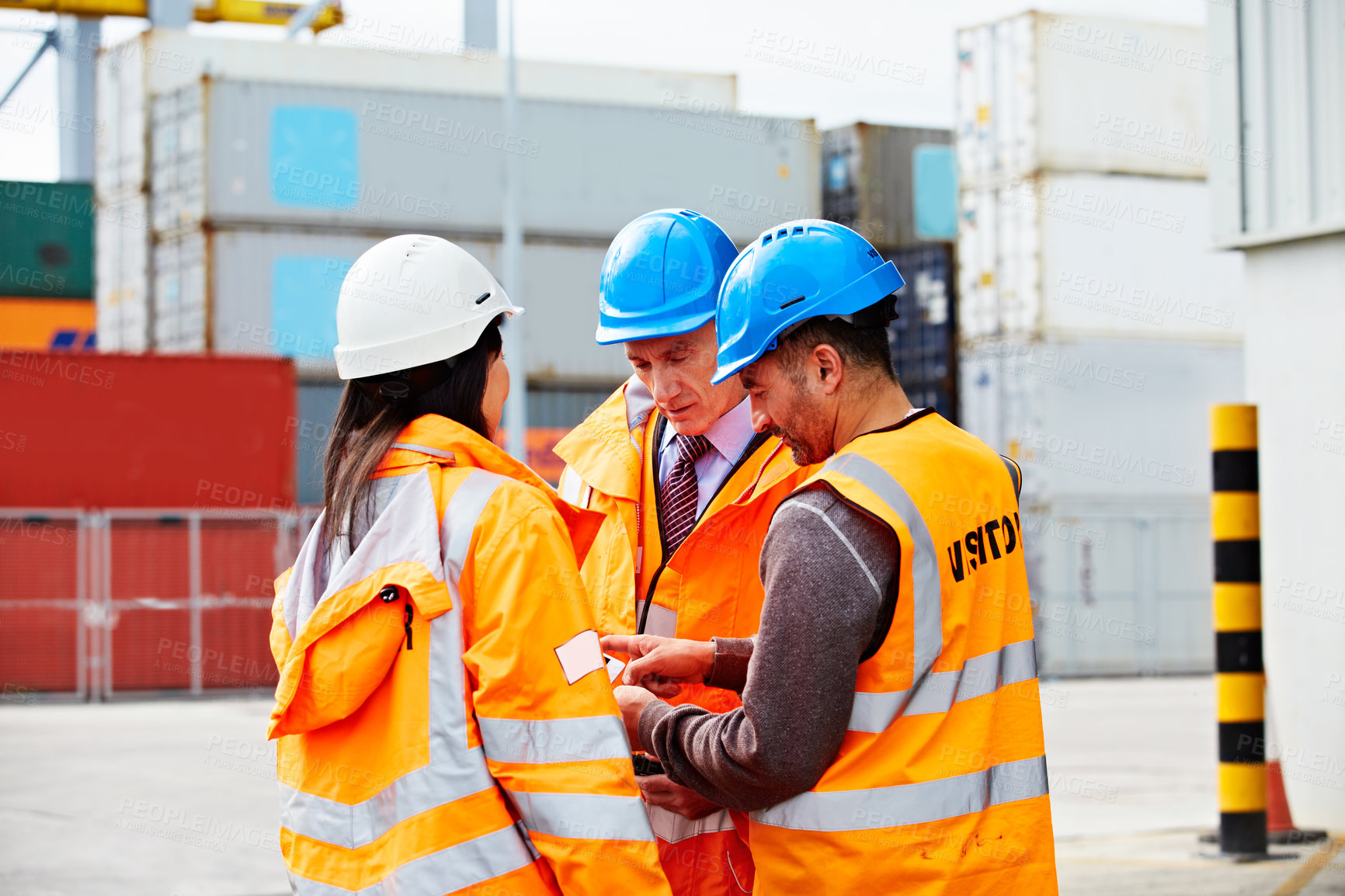 Buy stock photo Logistics, people and meeting in port with tablet, management or shipping discussion. Distribution team, mature foreman and tech in shipyard with engineer, quality control and safety compliance