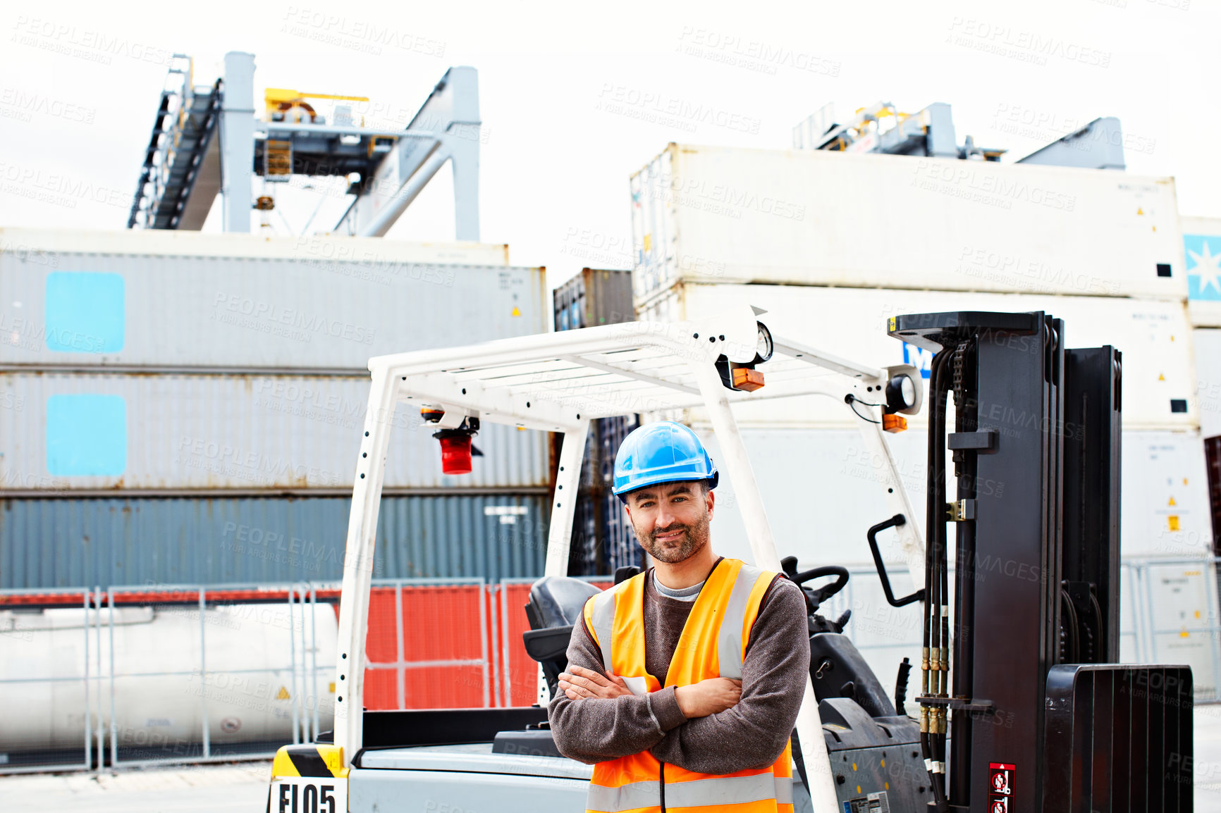Buy stock photo Portrait of a forklift operator working on a large commercial dock