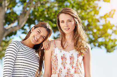 Buy stock photo Portrait of two young friends enjoying a day outside together