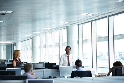 Buy stock photo Shot of a group of businesspeople talking in the office