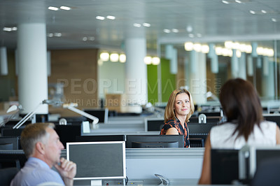 Buy stock photo Shot of a group of businesspeople talking in the office