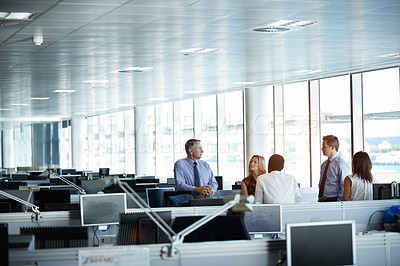 Buy stock photo Shot of a group of businesspeople talking in the office