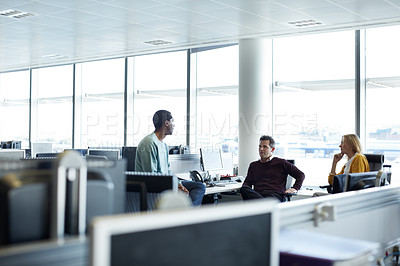 Buy stock photo Shot of a group of businesspeople talking in the office