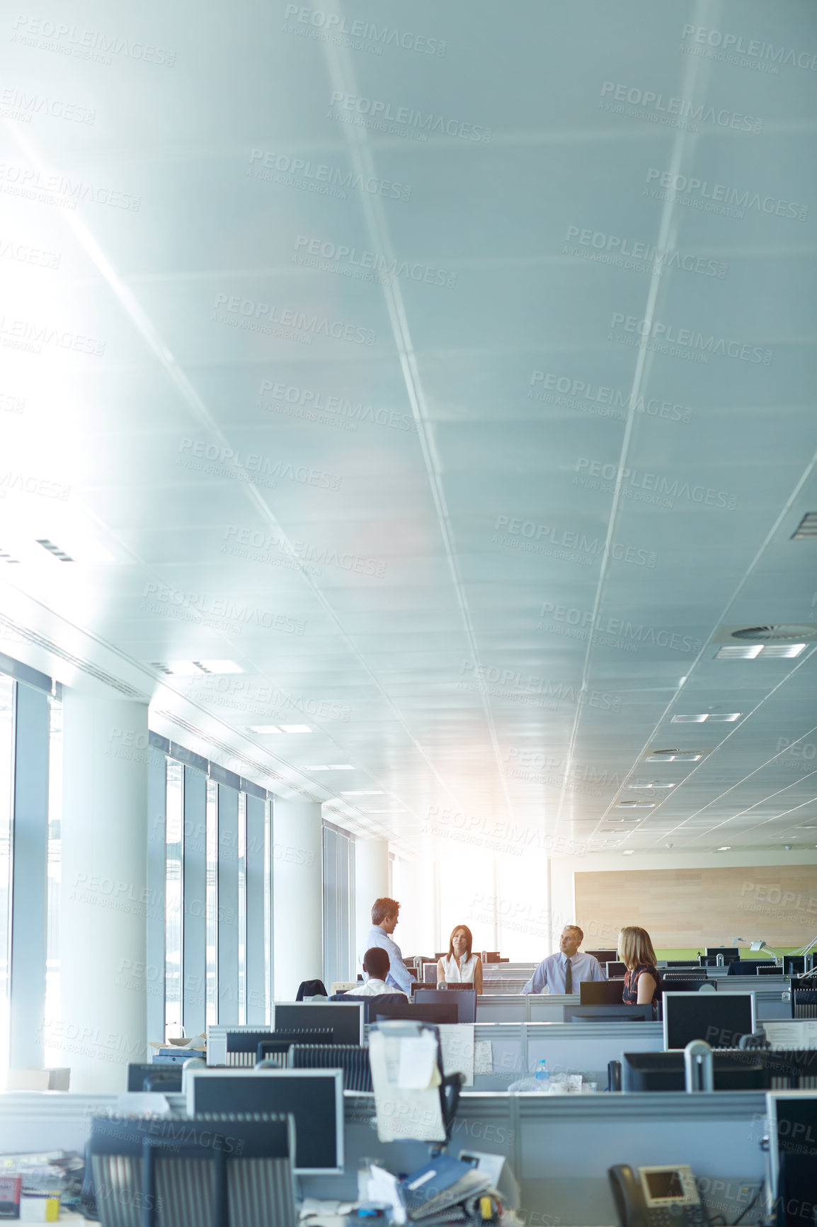 Buy stock photo Shot of a group of businesspeople talking in the office