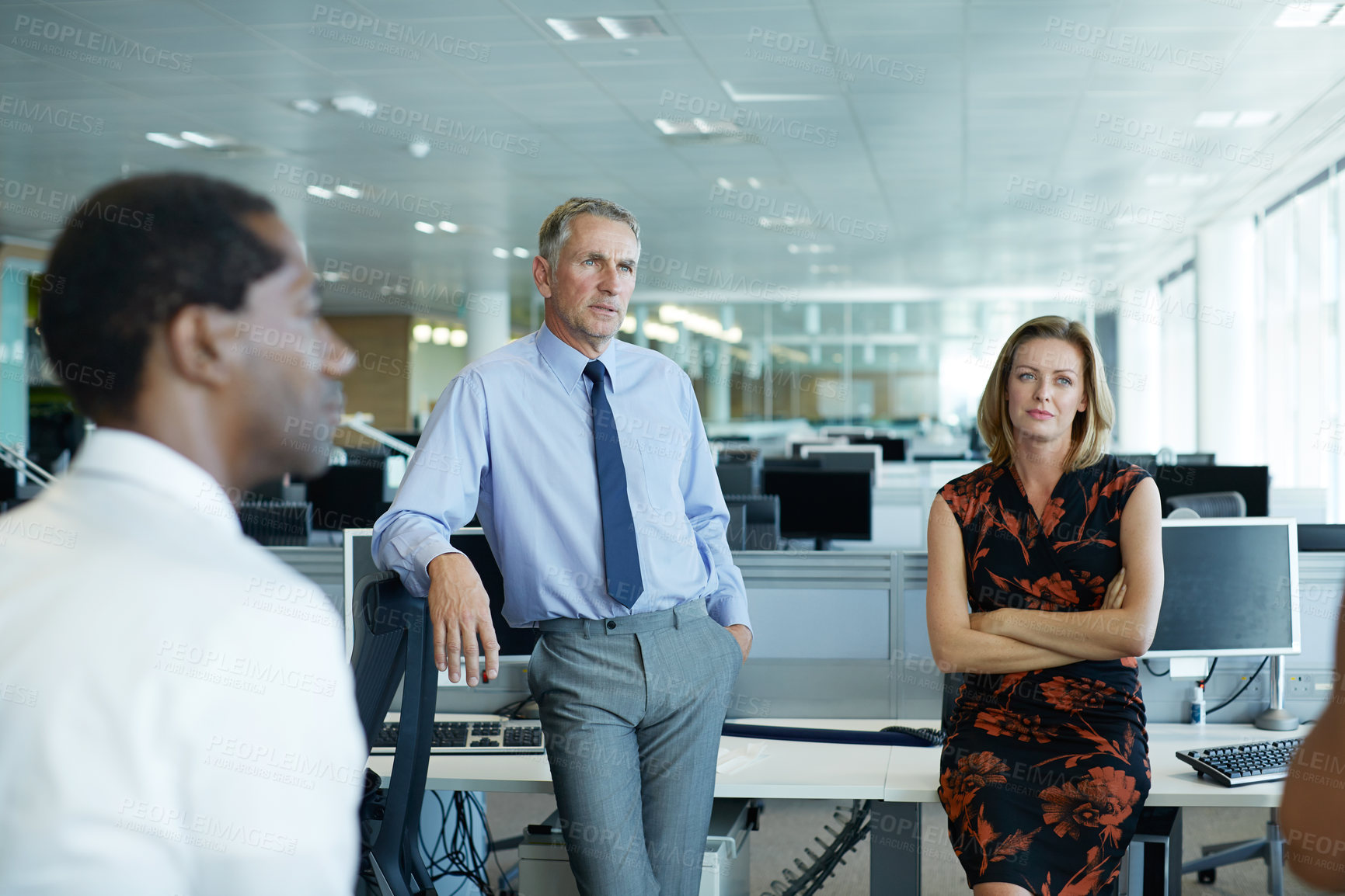 Buy stock photo Shot of a group of businesspeople talking in the office