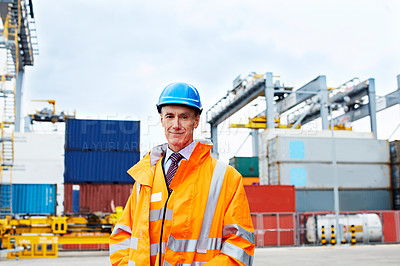 Buy stock photo Portrait of a mature man in workwear standing outside on a large commercial dock