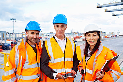 Buy stock photo Portrait of three workers standing on a commercial dock