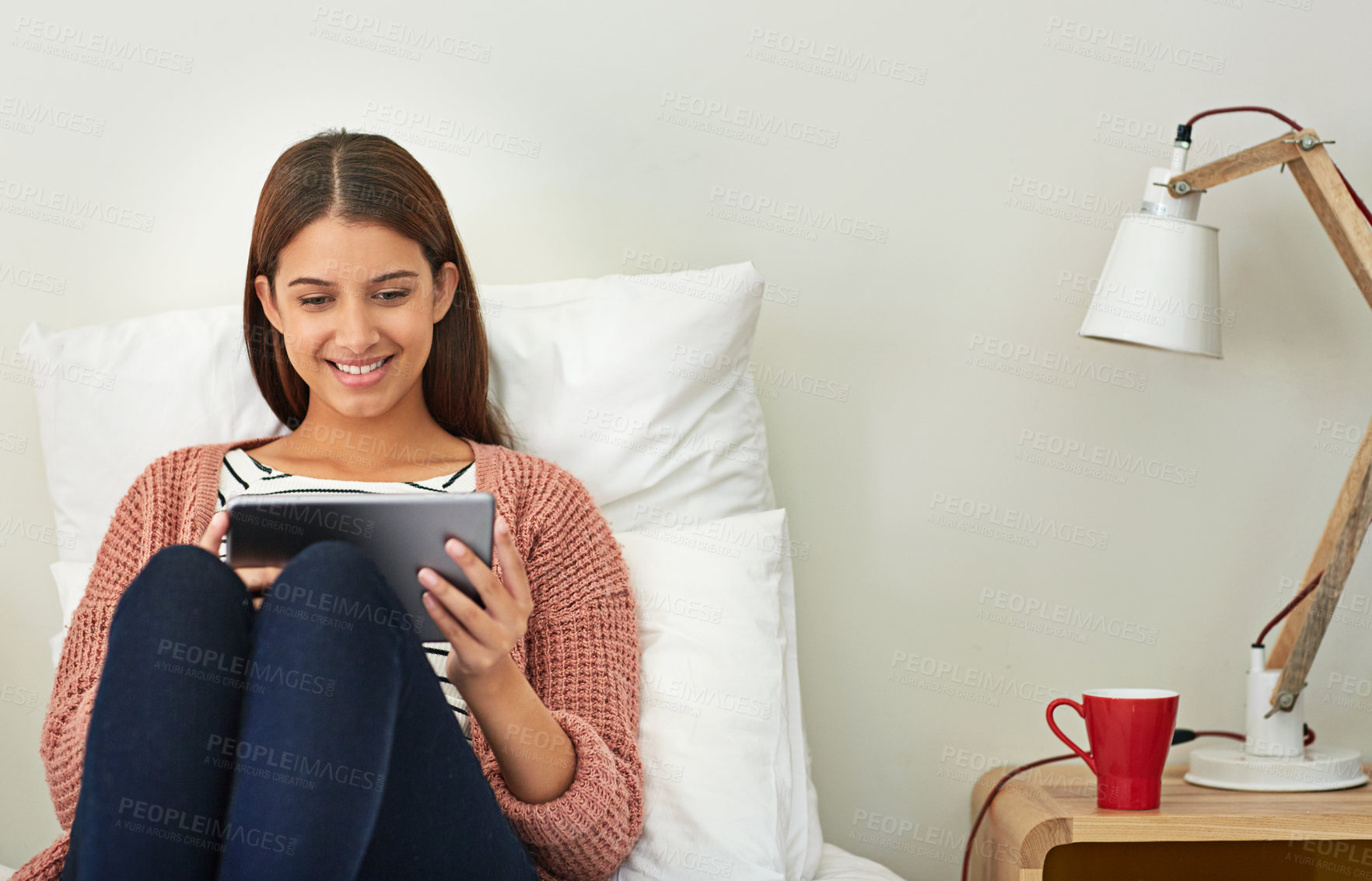 Buy stock photo Relax, woman and happy on bed with tablet, online movie and binge watching series on weekend break. Smile, girl or tech in home bedroom for streaming subscription, tv show or film on peaceful day off