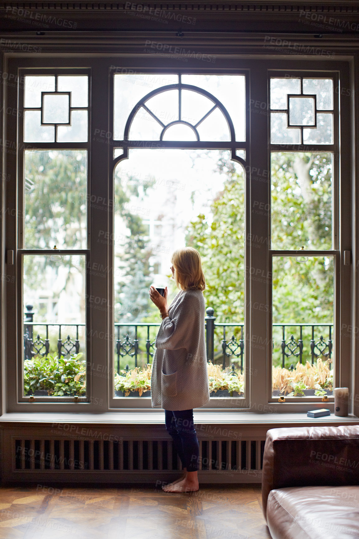 Buy stock photo Thinking, relax or woman at window with coffee, morning reflection or calm moment on weekend break. Chill, back and person in house with mug, peaceful perspective and mindfulness at start of day.