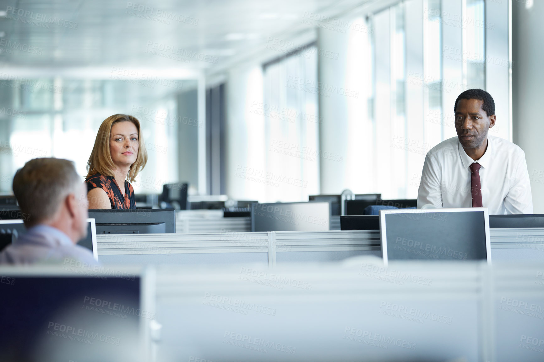 Buy stock photo Shot of a group of businesspeople talking together in the office