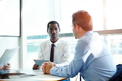 Buy stock photo Shot of two businesspeople having a meeting in an office