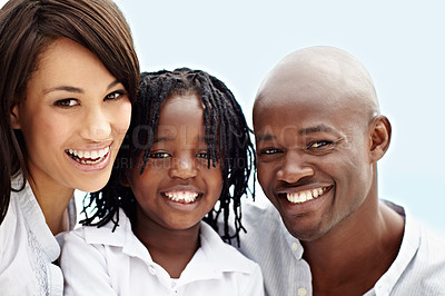 Buy stock photo Portrait of a young family standing outside