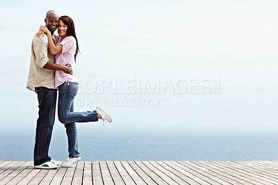Buy stock photo Full length portrait of an affectionate couple enjoying a day outside together