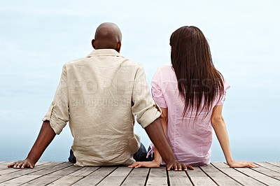 Buy stock photo Rearview shot of an affectionate couple enjoying a day outside together