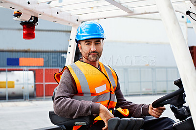Buy stock photo Portrait of a forklift operator working on a large commercial dock