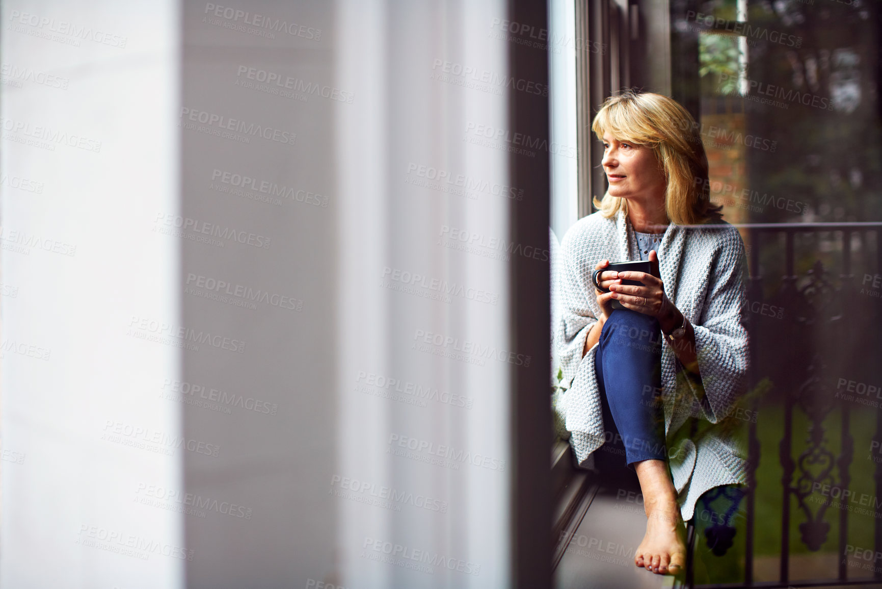 Buy stock photo Thinking, woman and window in home with coffee, vision and daydreaming for weekend unwind. Morning, mature person and beverage at house with reflection, nostalgia memory and daylight of outdoor view 