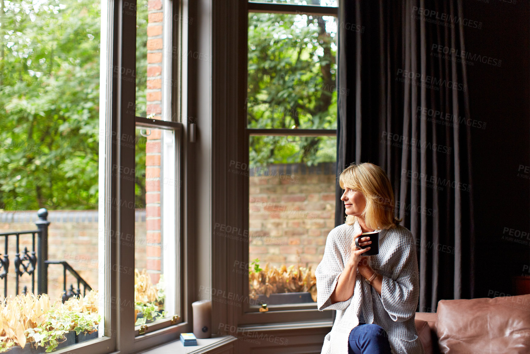 Buy stock photo Thinking, smile or woman at window with coffee, morning reflection or chill moment on weekend break. Calm, happy or mature person in home with mug, peaceful perspective or mindfulness at start of day