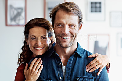 Buy stock photo Portrait of an affectionate mature couple in their living room