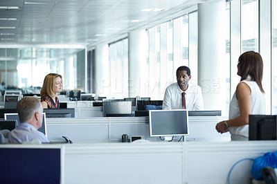 Buy stock photo Shot of a group of businesspeople talking together in the office