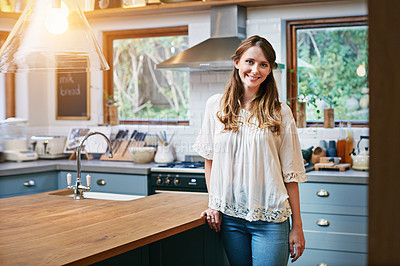 Buy stock photo Portrait of a smiling young woman standing in a kitchen