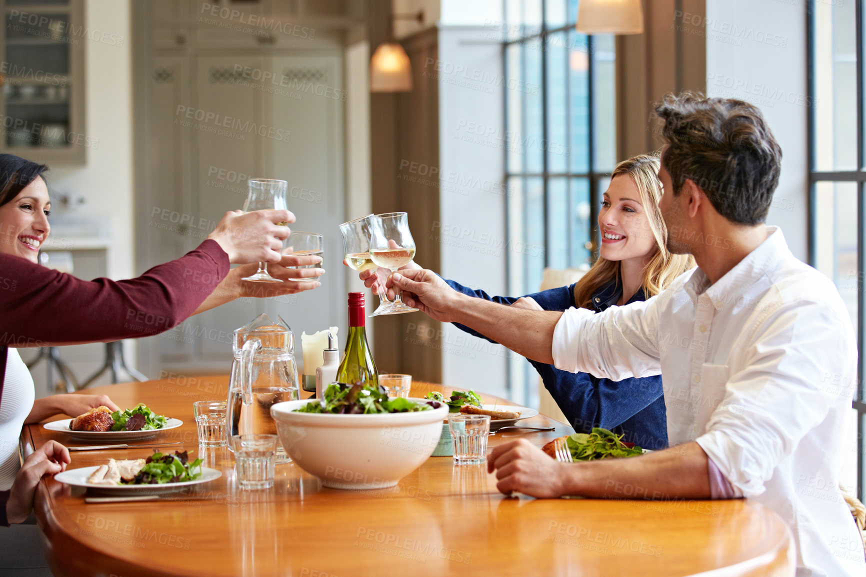 Buy stock photo Cheers, glasses or wine with couple of friends for dining, social gathering or reunion together. Happy group, people or toasting with smile or alcohol for weekend celebration or thanksgiving in house