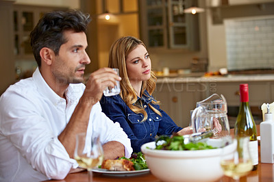 Buy stock photo Shot of a young couple having dinner together