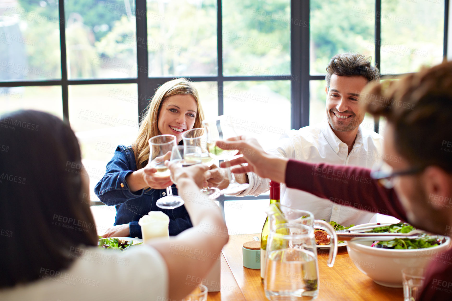 Buy stock photo Happy, friends or cheers with wine for dinner party, reunion celebration or bonding at dining table. Food, people and drinks toast in home for social event, group appreciation or friendship gratitude