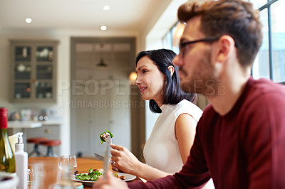 Buy stock photo Shot of a young couple having dinner together