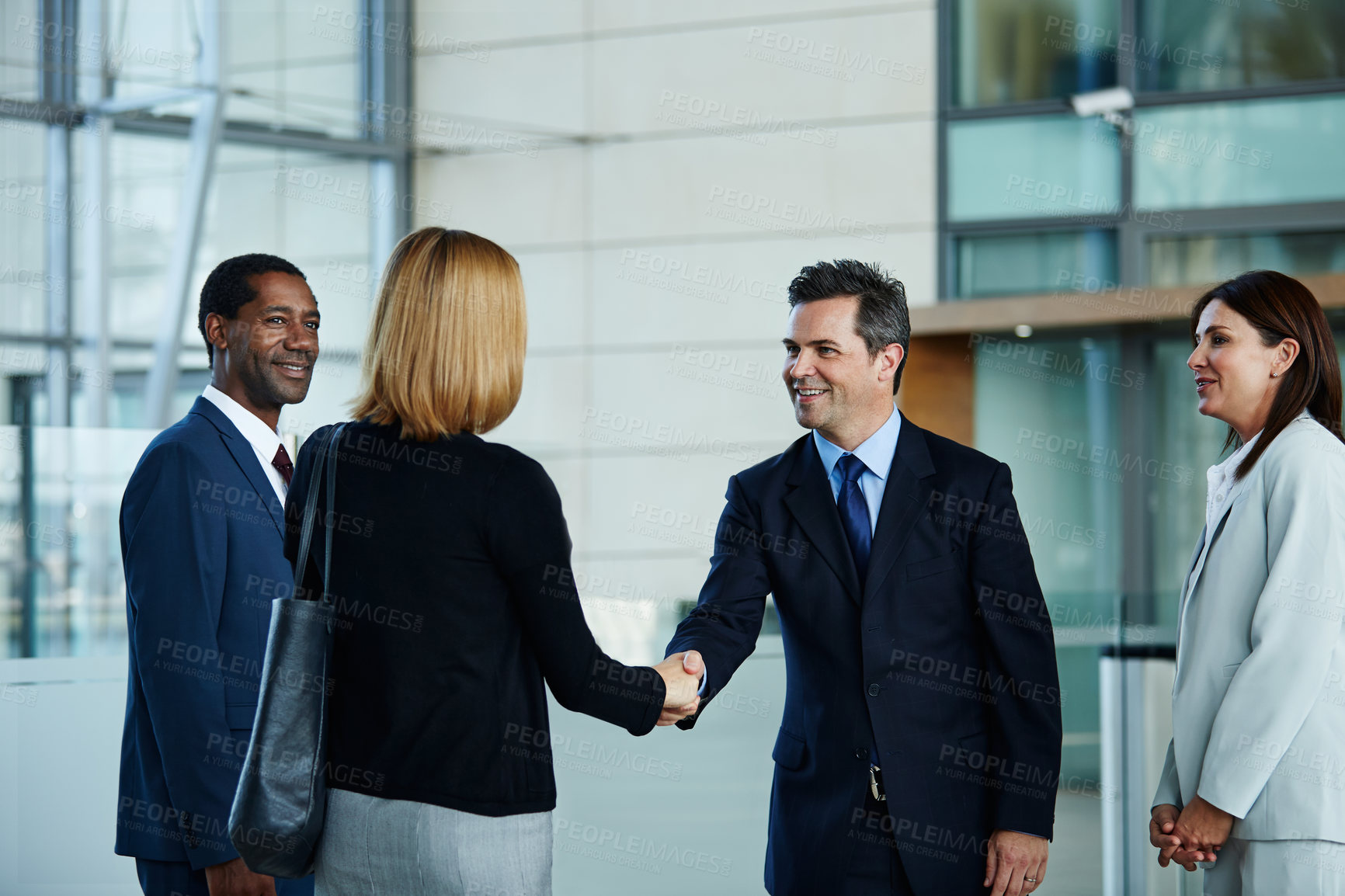Buy stock photo Meeting, handshake and smile with business people in office for agreement, broker firm and thank you. Account manager, investor advice and greeting with employees shaking hands for b2b introduction