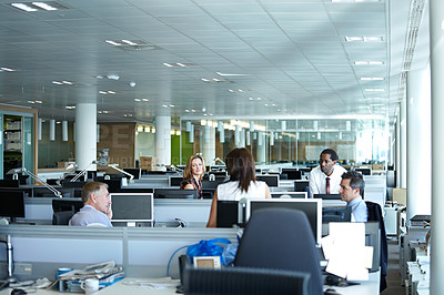 Buy stock photo Shot of a group of businesspeople talking in the office