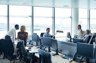 Buy stock photo Shot of a group of businesspeople talking in the office