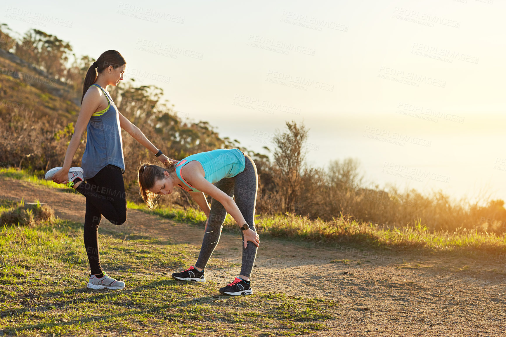 Buy stock photo Fitness, outdoor and friends stretching together for workout, exercise and wellness for health in nature. Space, sunset and women training in summer for morning, warm up and ready on mountain